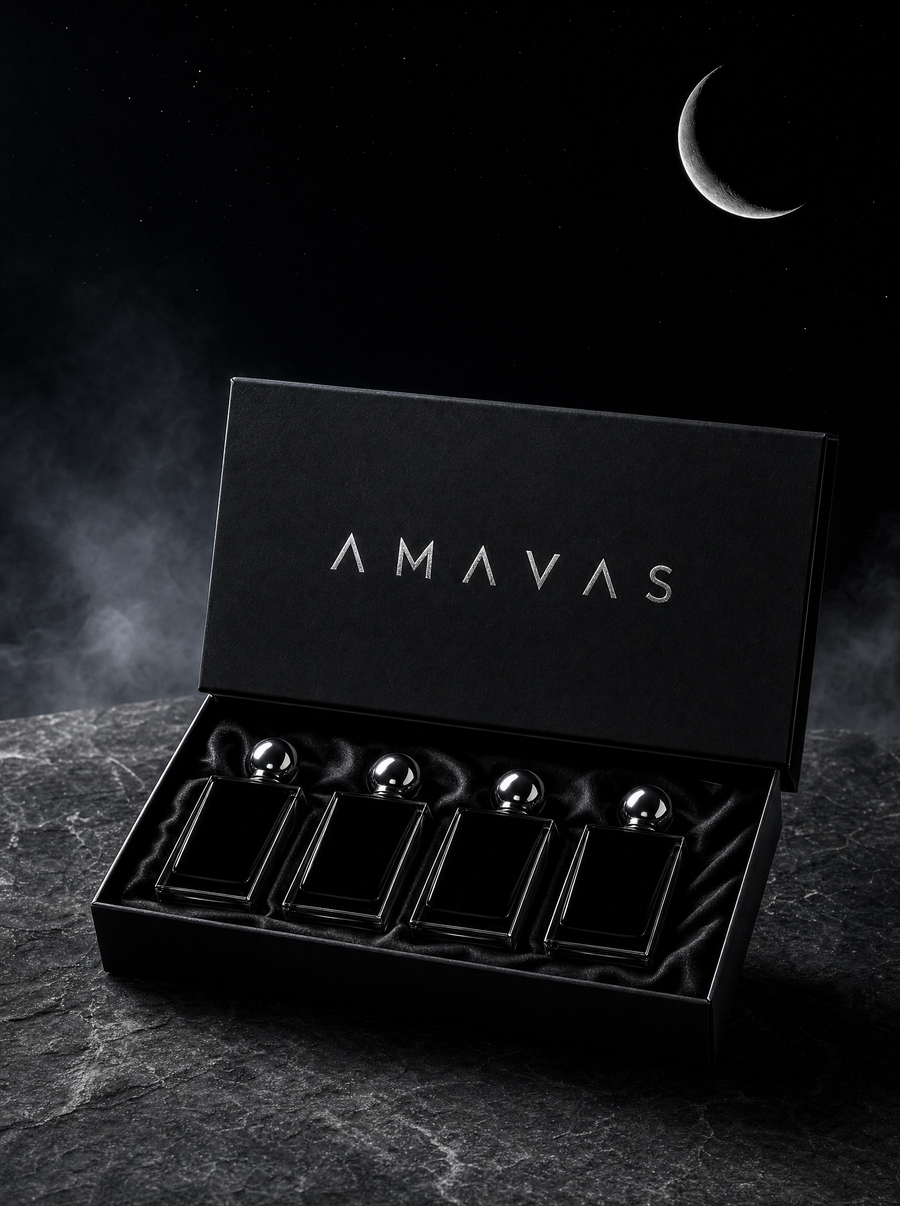 The AMAVAS Festival Pack: four 100 ml parfums in a matte black gift box with the AMAVAS wordmark in silver